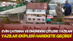 Evin çatısına ve önündeki çitlere yazılan yazılar ekipleri harekete geçirdi